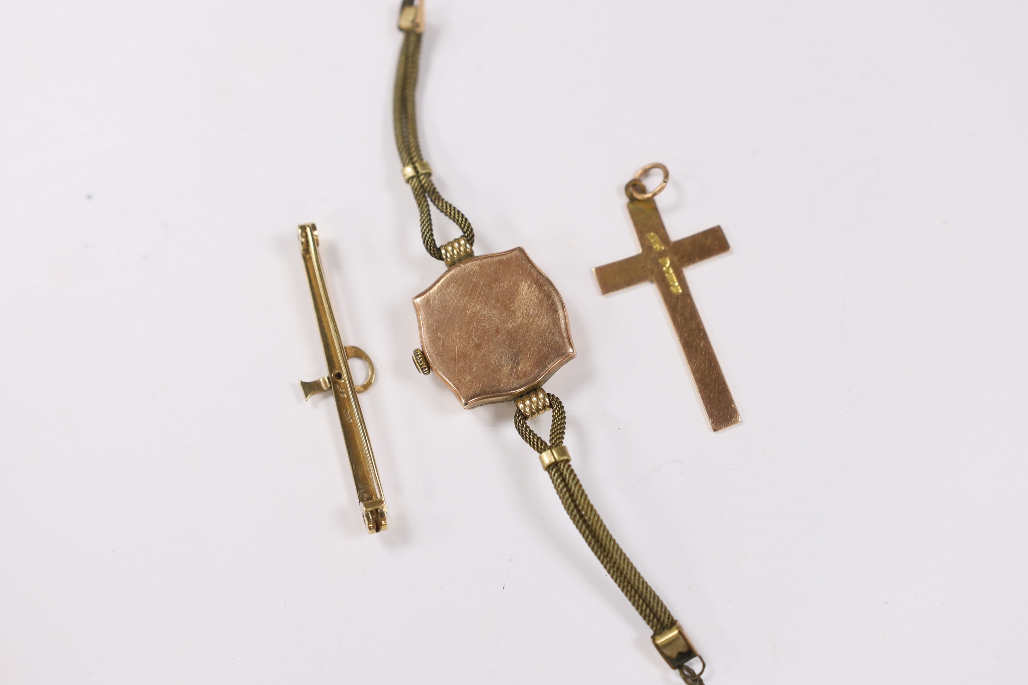 A lady's yellow metal manual wind wrist watch, the dial inscribed 'Rolex', a 9ct gold cross pendant and a 9ct bar brooch.